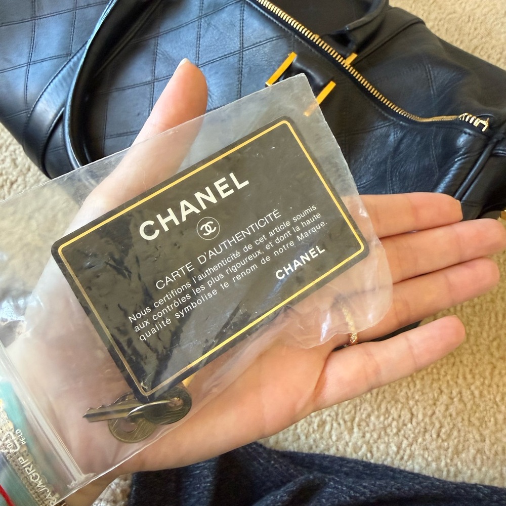 CHANEL Black Quilted Leather Travel Weekender with Gold Logo Charm - Picture 13 of 13